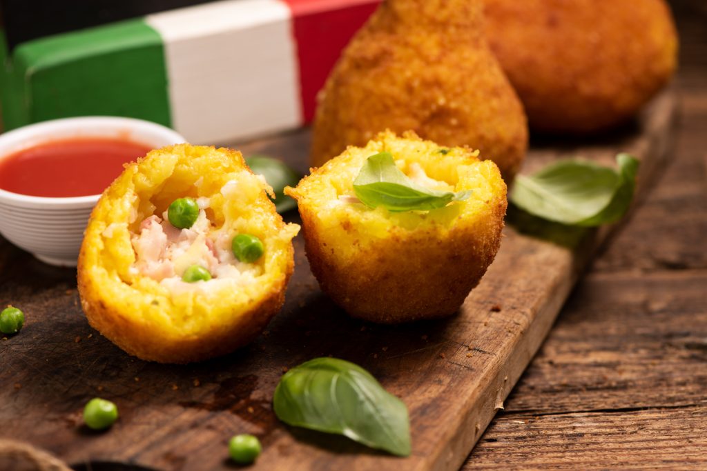 Delicious rice balls made with fried rice. typical dish of sicilian italian cuisine . Arancini close up